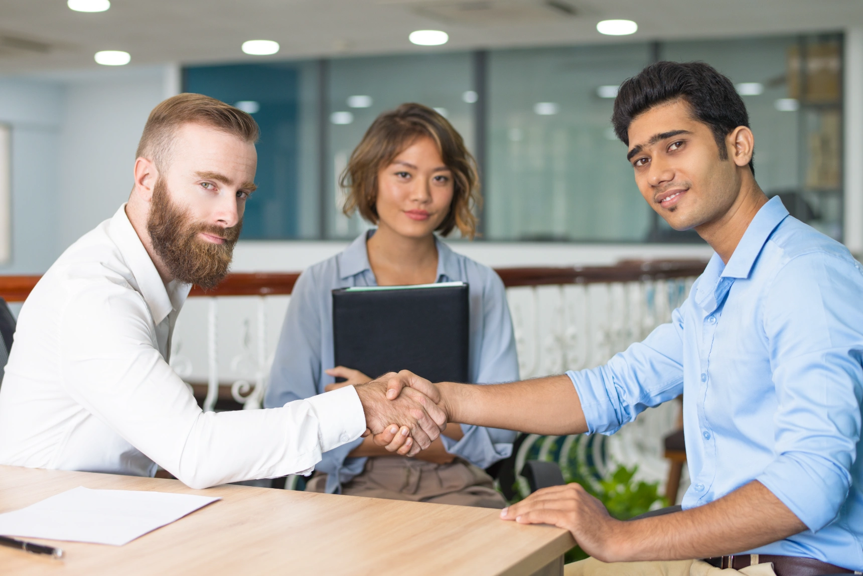 content-indian-candidate-shaking-hands-with-company-leader